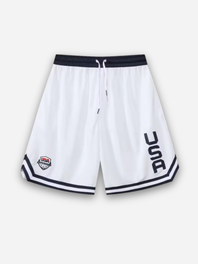 White athletic shorts with navy waistband, USA lettering, crest and striped hems